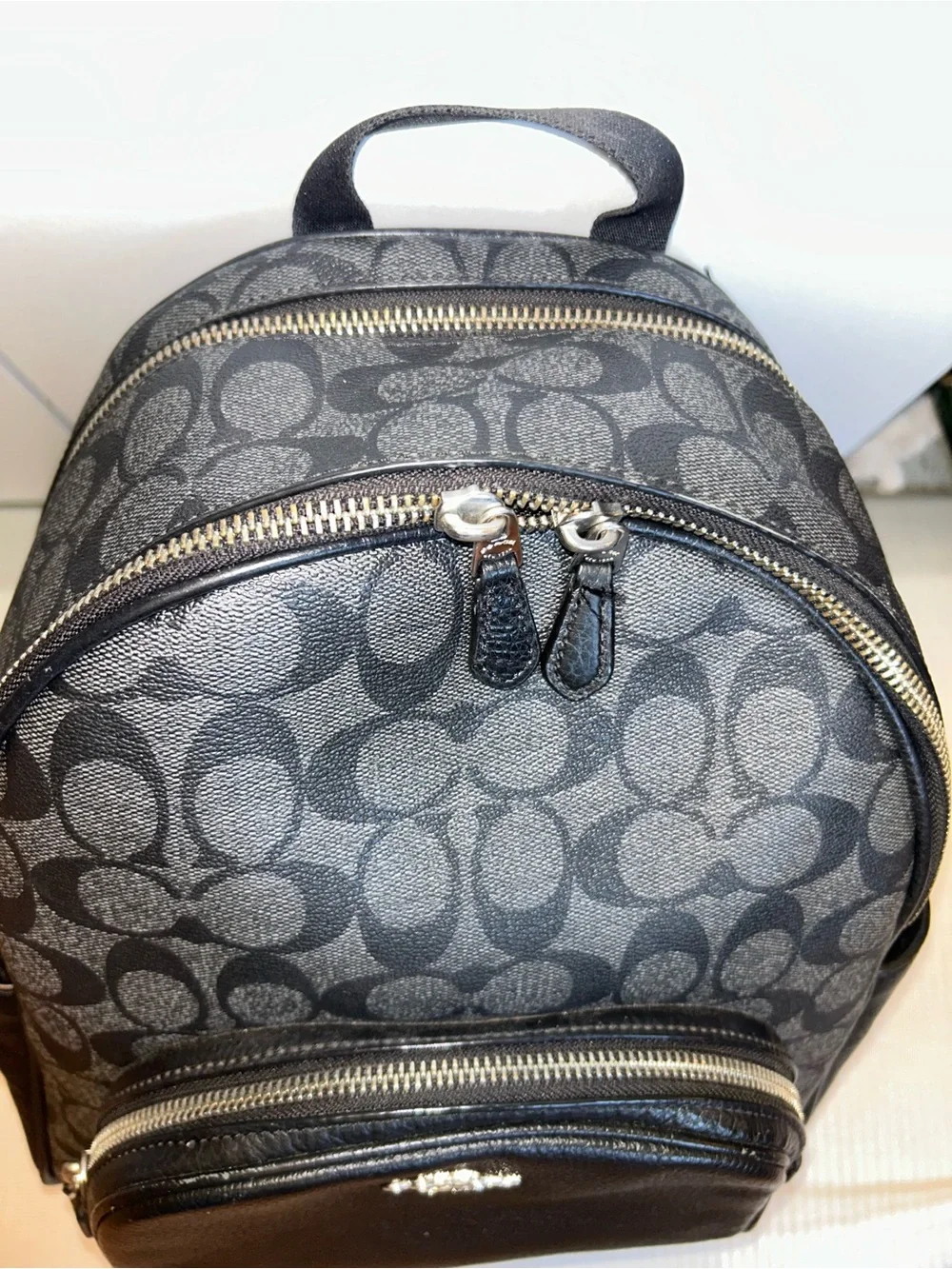 Coach one zip